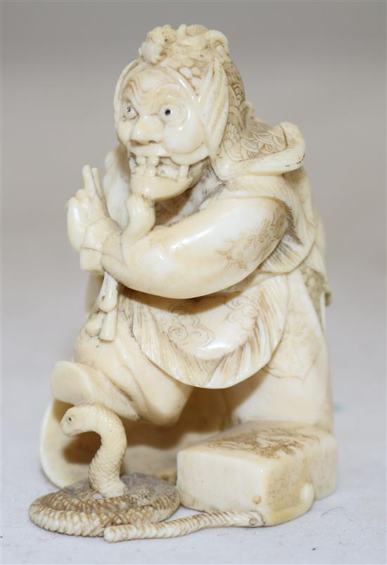 A Japanese ivory okimono of a bugaku dancer